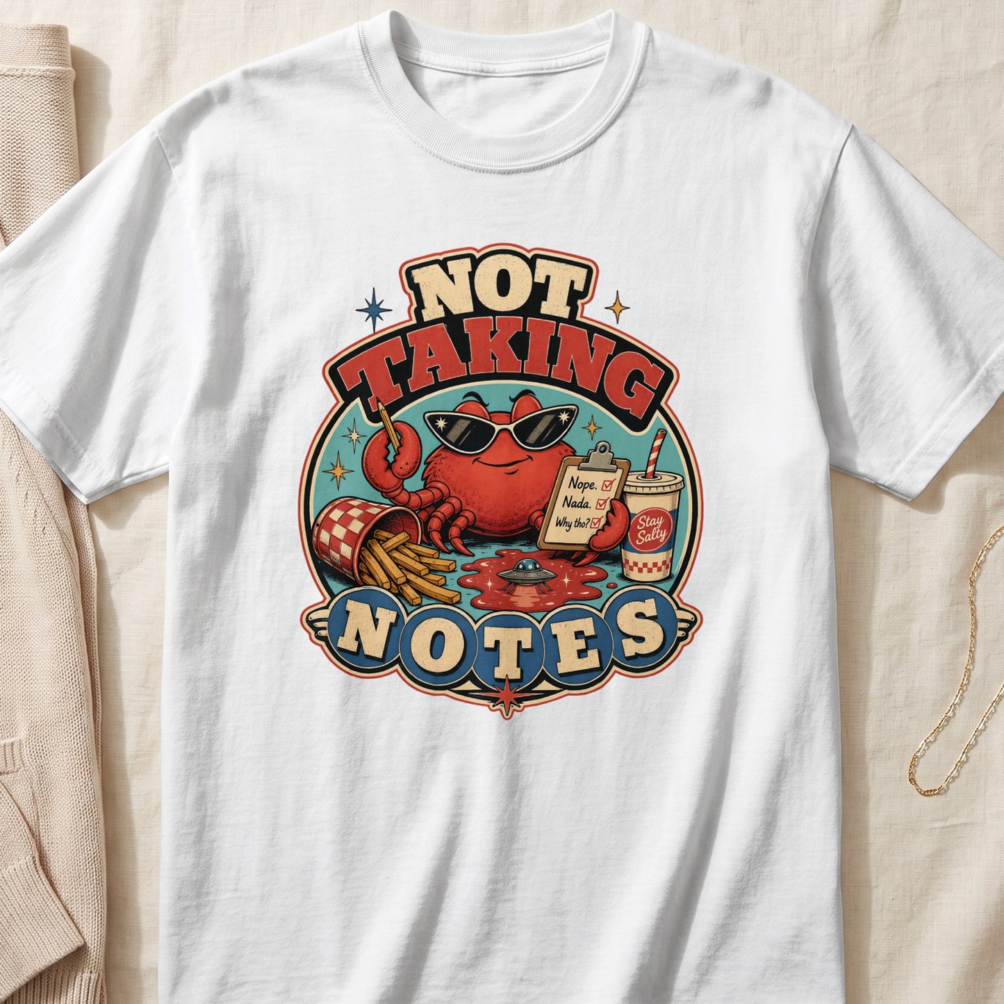 Crab with sunglasses holding notepad and french fries, text "NOT TAKING NOTES"