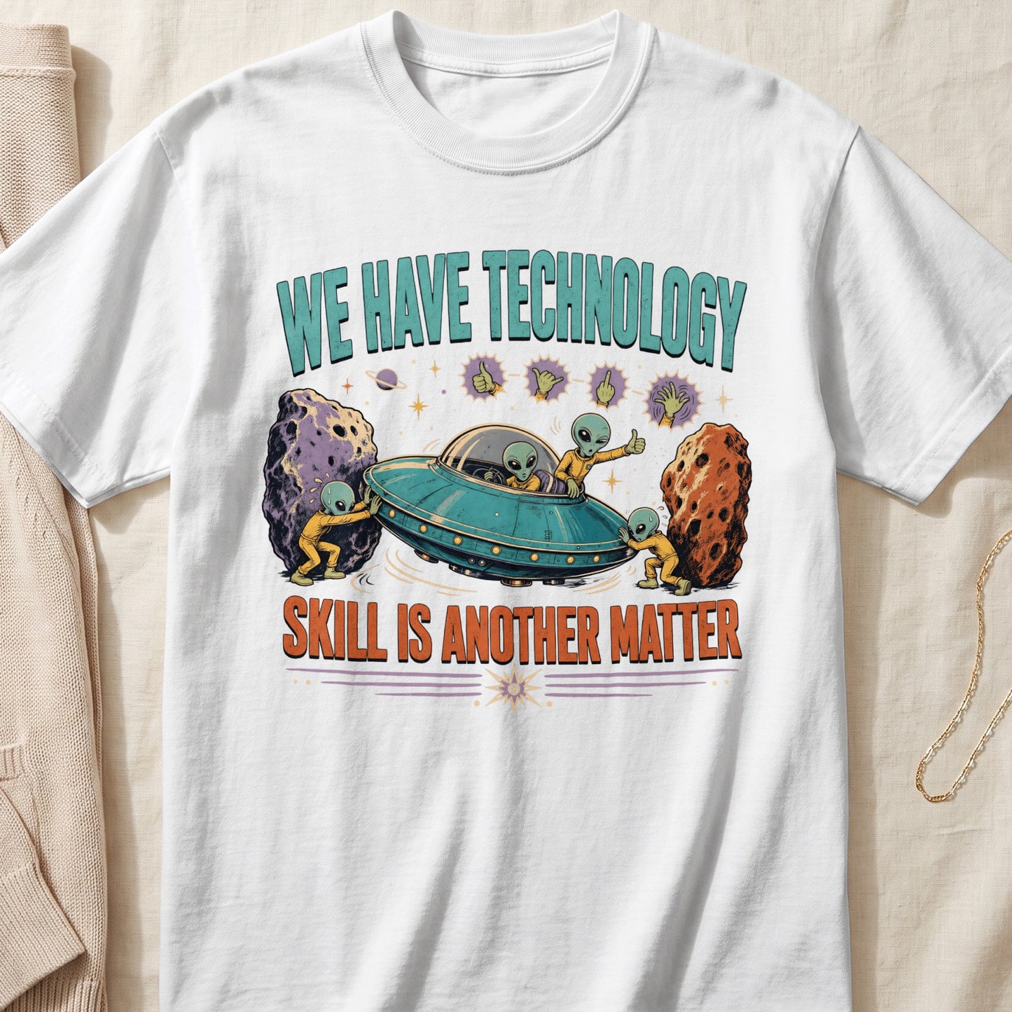 T-shirt with aliens, a UFO, asteroids, and text "WE HAVE TECHNOLOGY SKILL IS ANOTHER MATTER".