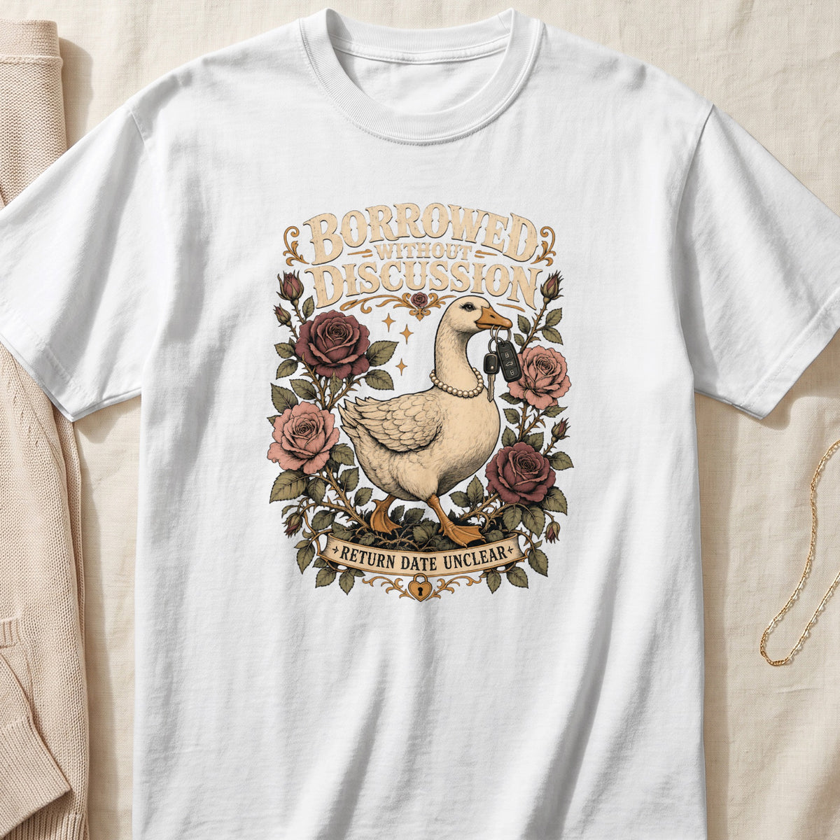 Goose with keys in mouth, "Borrowed Without Discussion, Return Date Unclear" text, surrounded by roses.