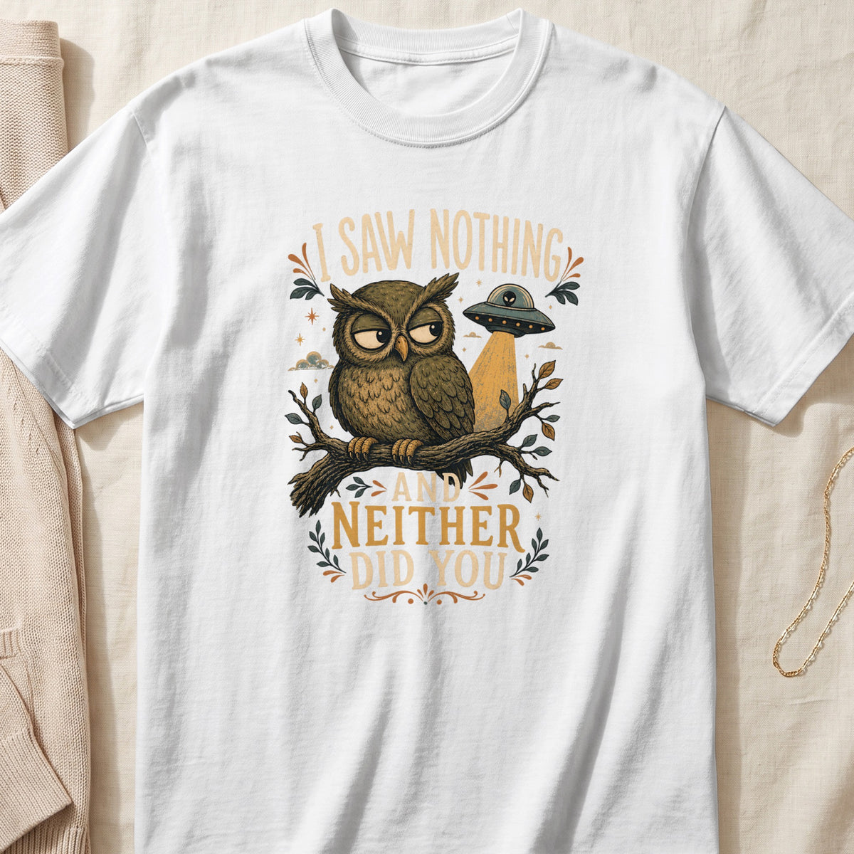 White t-shirt with an owl, UFO, and text "I Saw Nothing And Neither Did You."