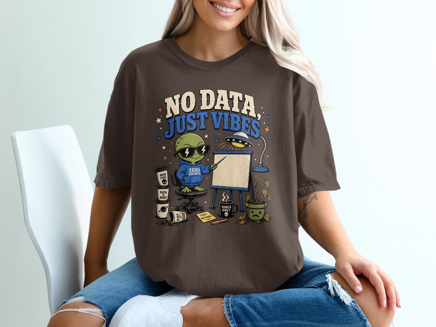 Brown t-shirt with alien graphic and text "NO DATA, JUST VIBES".
