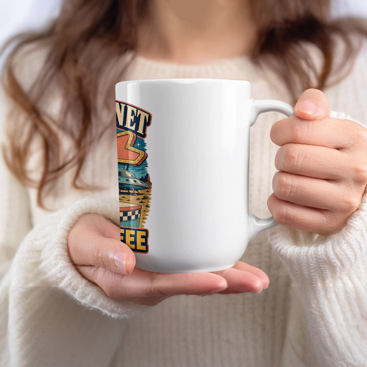 White mug with retro alien and desert design that reads "NET COFFEE".