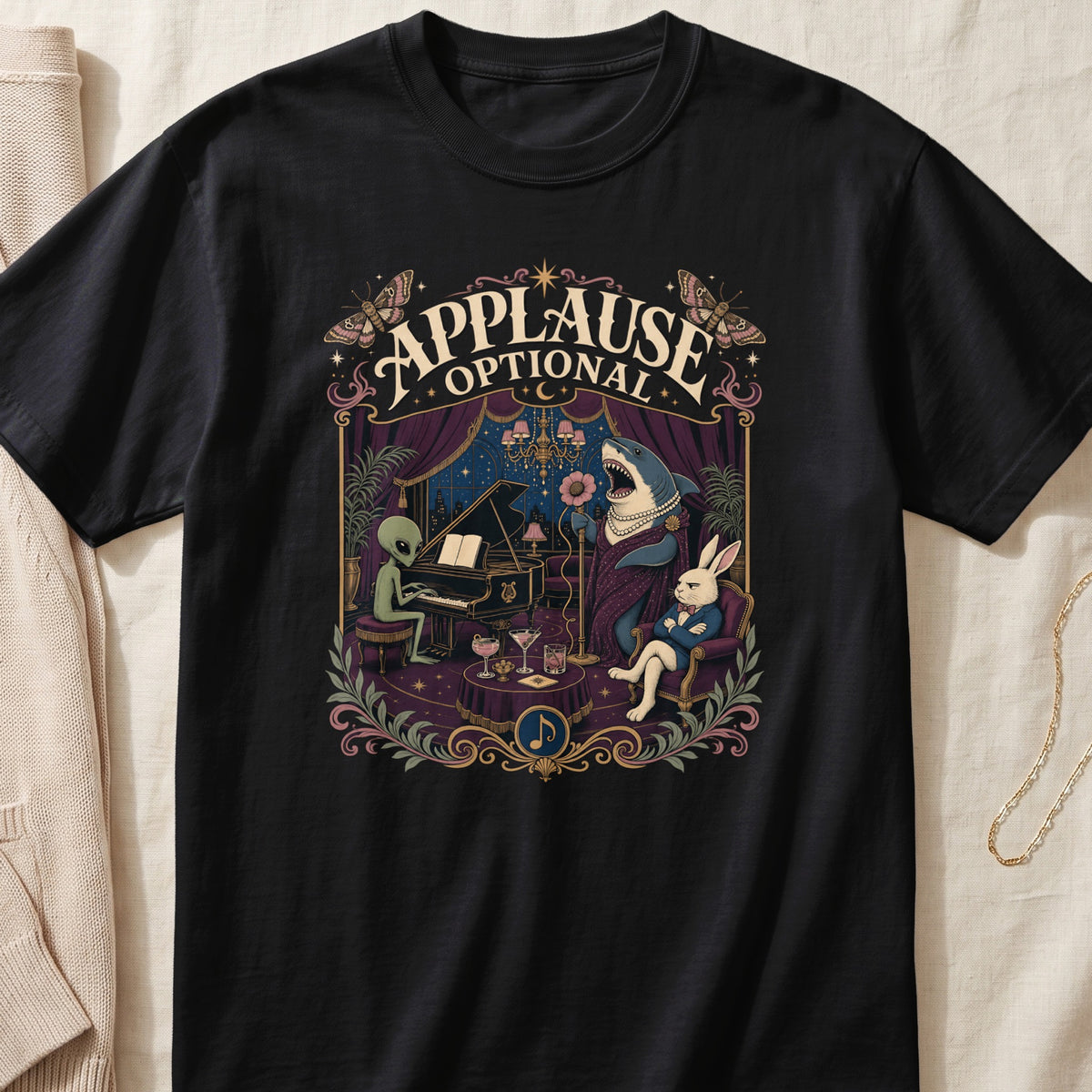 T-shirt graphic features an alien playing piano, a shark singing, and a rabbit listening.