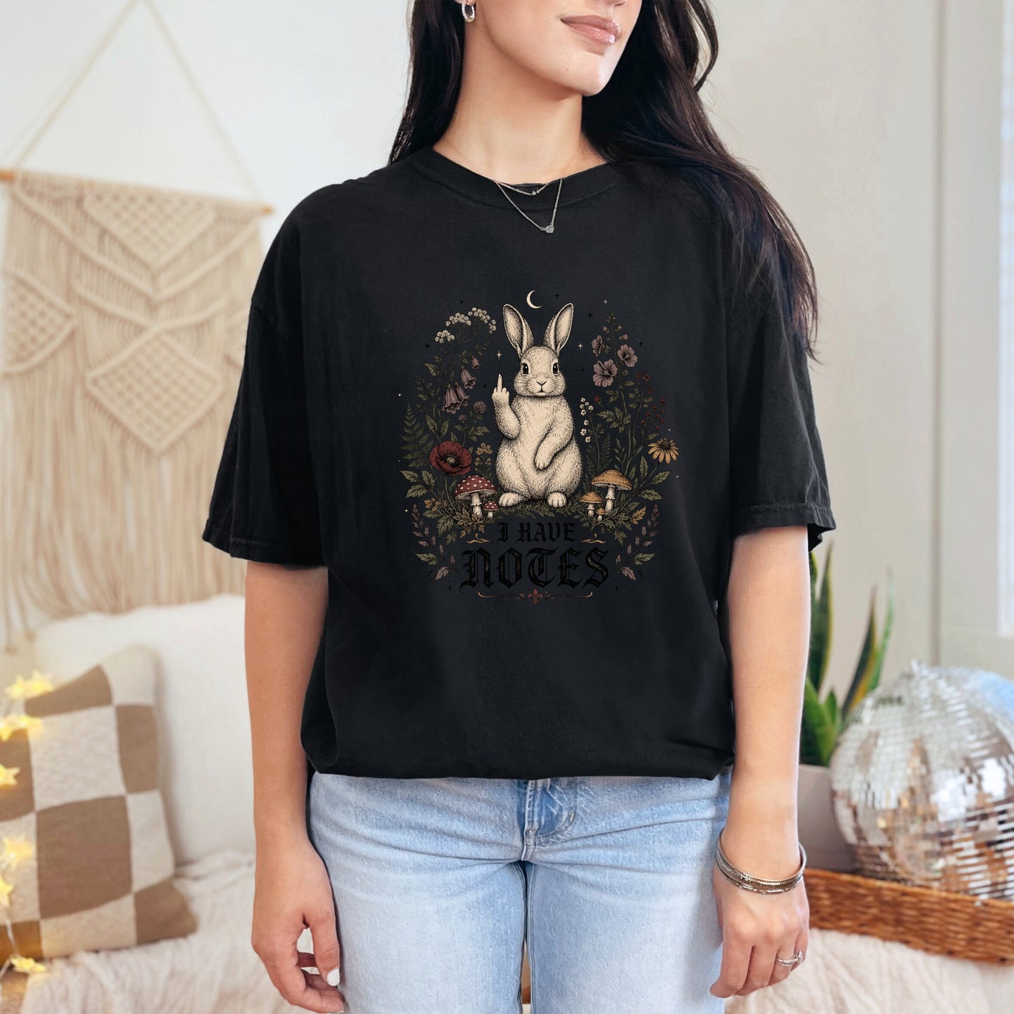 Black t-shirt with a white rabbit holding up a middle finger and text "I HAVE NOTES".