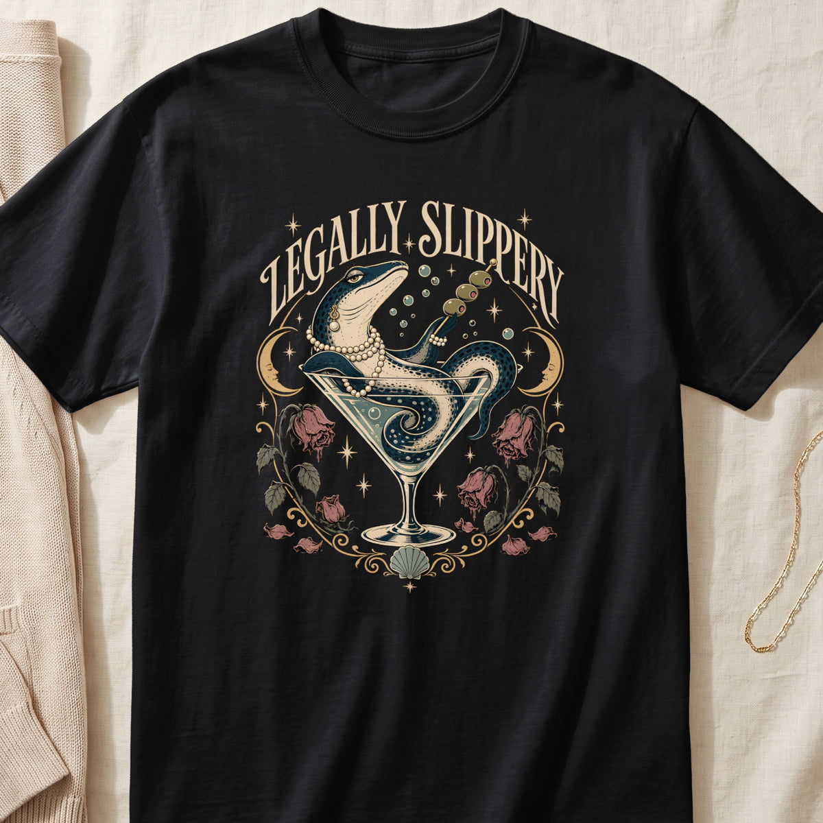 Black t-shirt with a martini glass, lizard, olives, and "LEGALLY SLIPPERY" text.