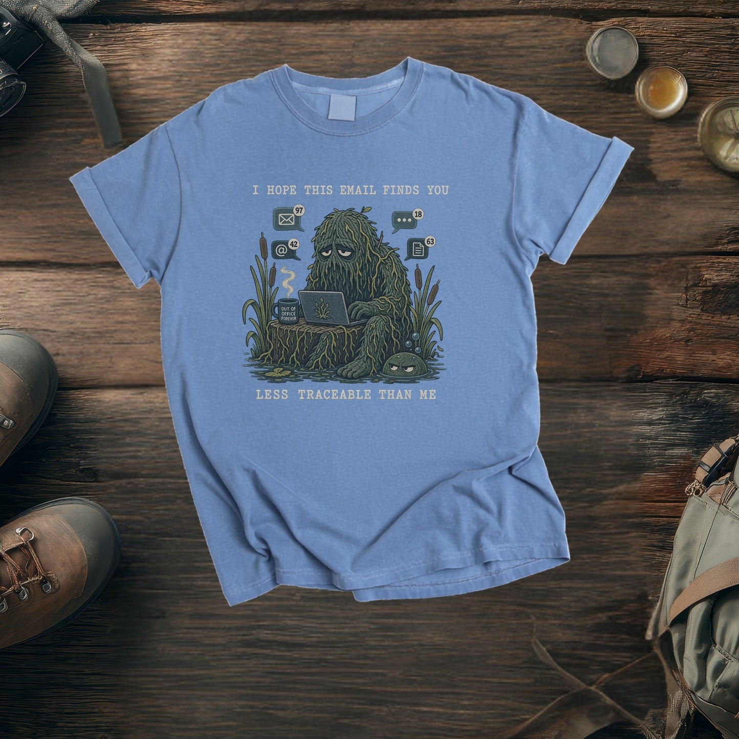 Blue t-shirt with "I hope this email finds you less traceable than me" graphic.