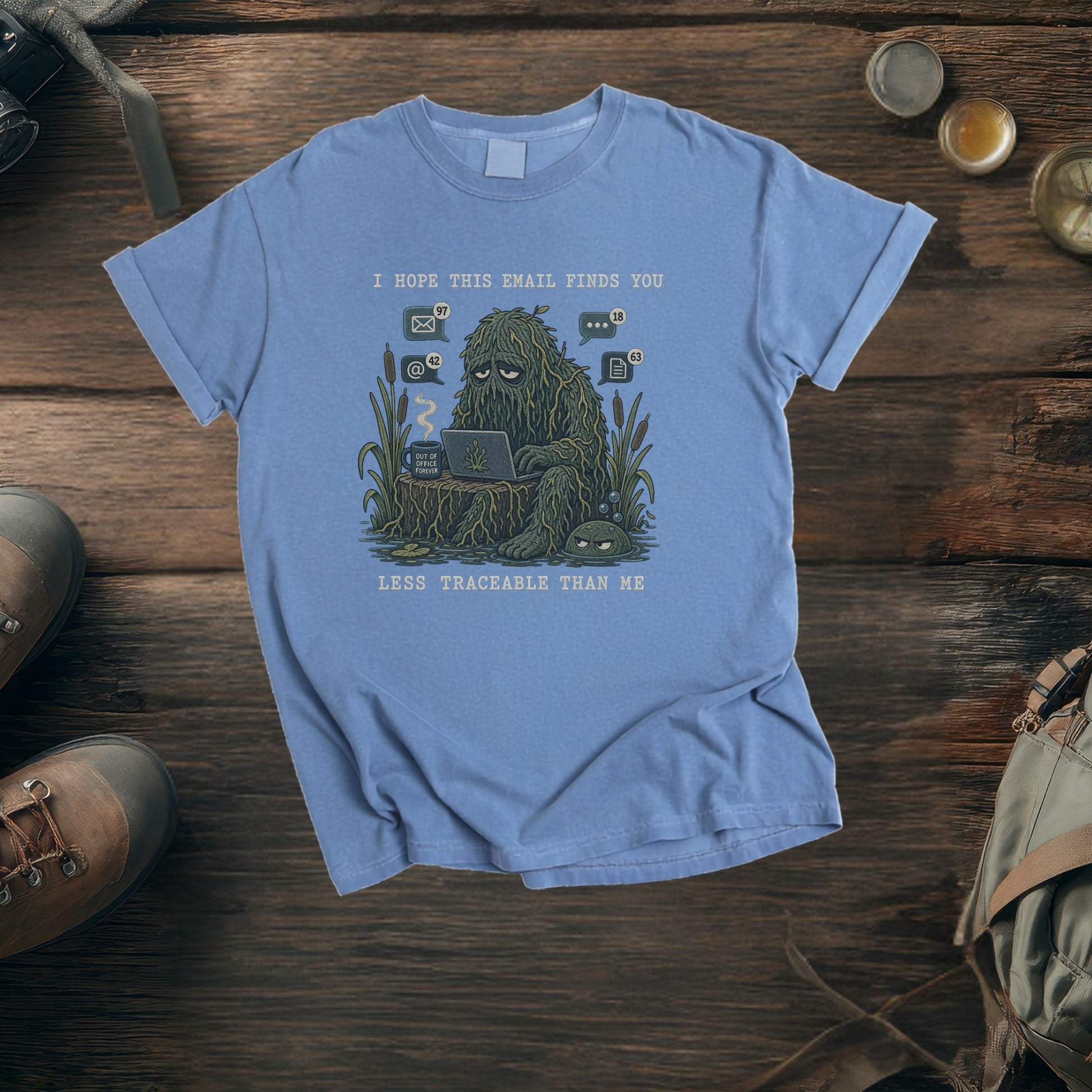 Blue t-shirt with "I hope this email finds you less traceable than me" graphic.