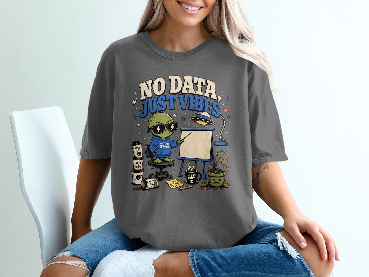 T-shirt graphic with alien saying "NO DATA JUST VIBES" and "ZERO REPORTS" hoodie.