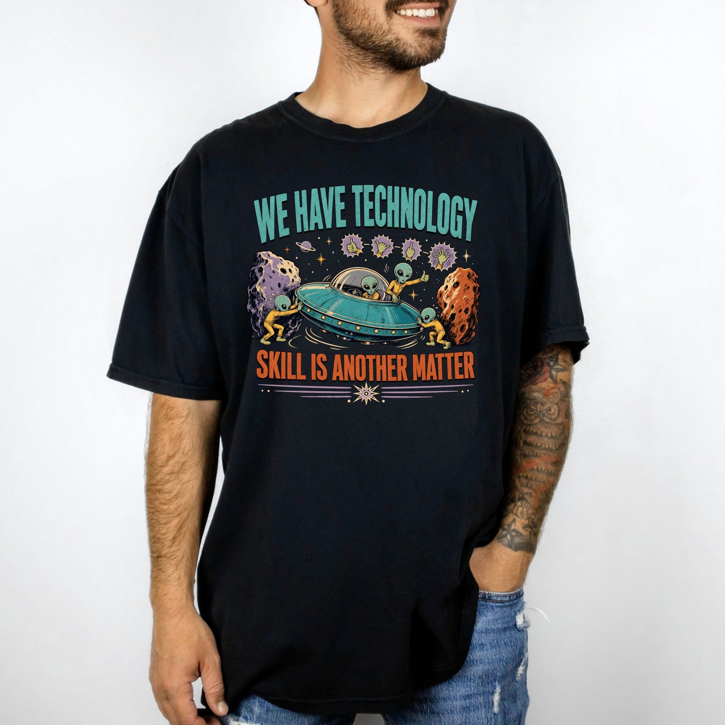 Black t-shirt with aliens, UFO, and text "WE HAVE TECHNOLOGY SKILL IS ANOTHER MATTER".