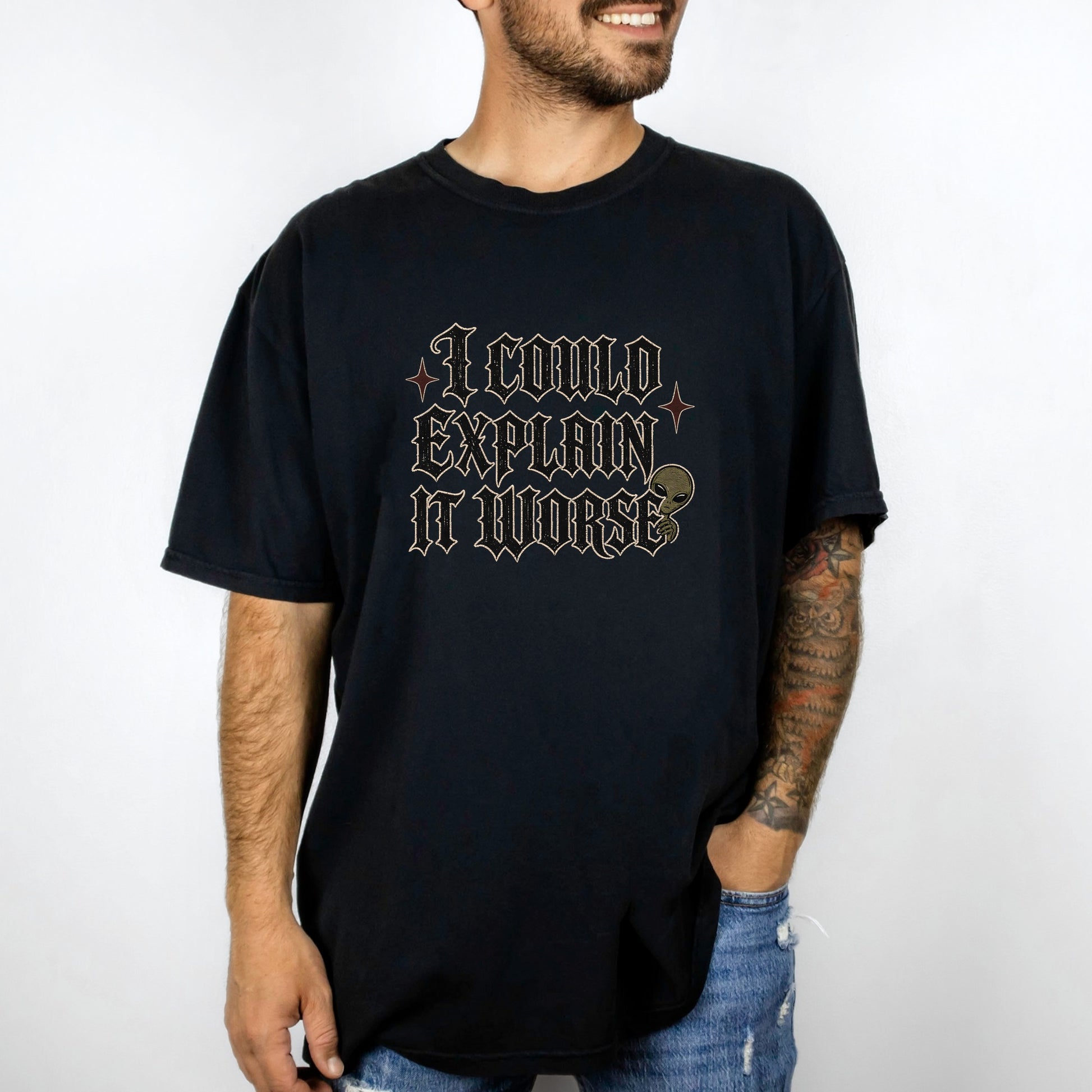 Black t-shirt with text "I COULD EXPLAIN IT WORSE" and an alien graphic.