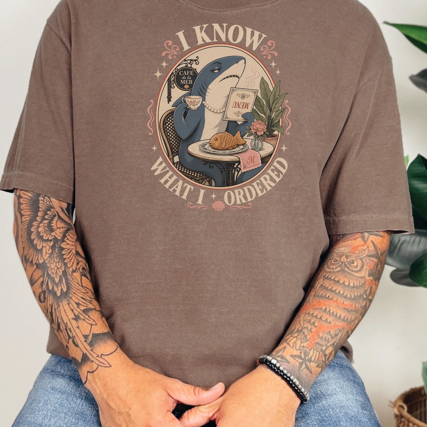 T-shirt with cartoon shark in cafe, "I know what I ordered" text.