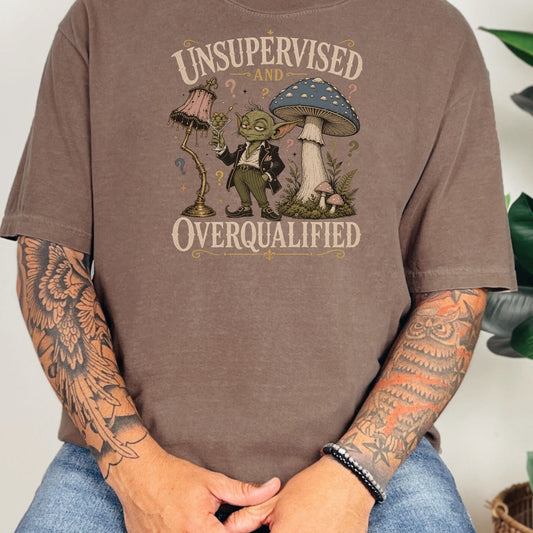 Green creature holds olive martini glass beside lamp and mushroom, text "Unsupervised and Overqualified".