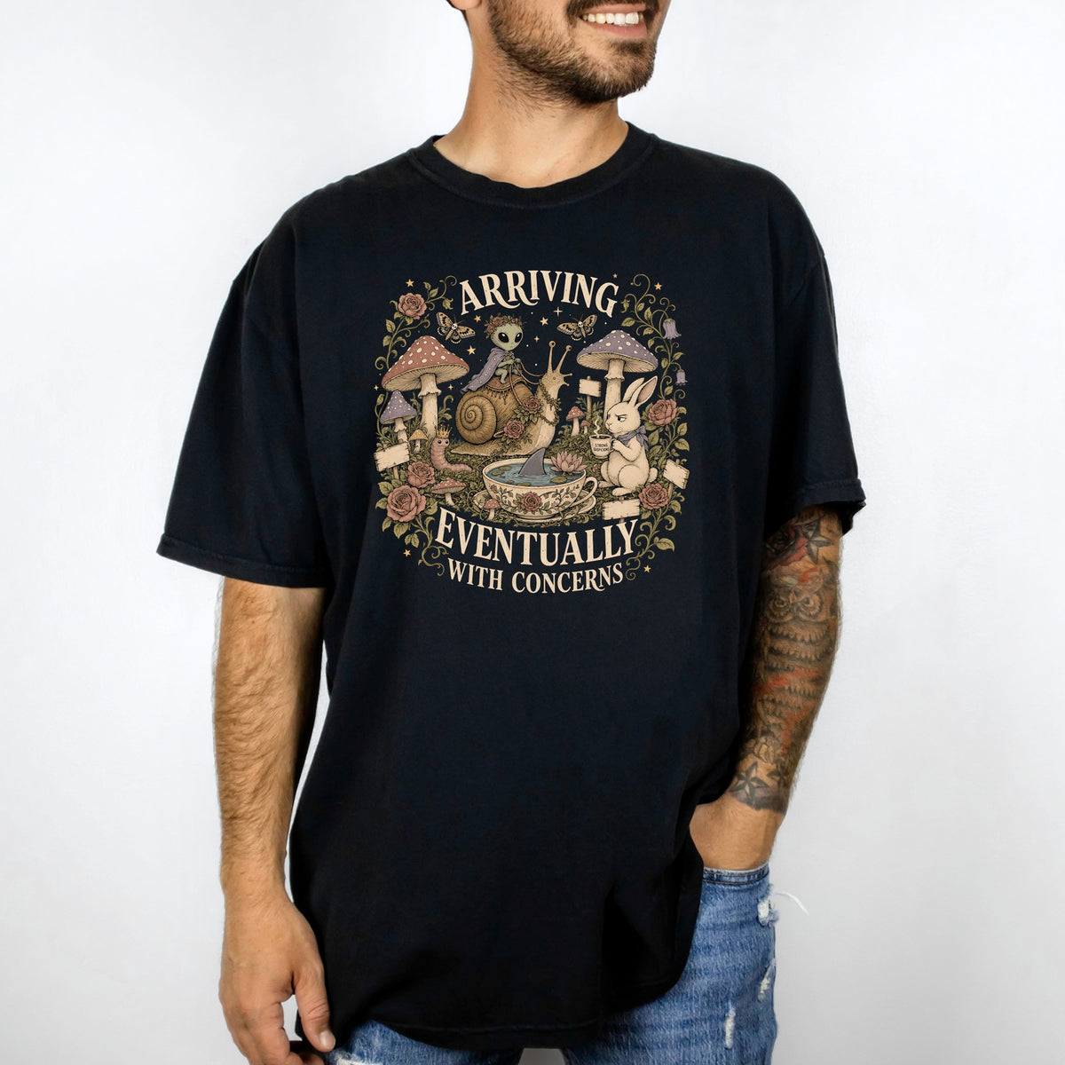 Black t-shirt with a circular graphic featuring an alien on a snail, mushrooms, and text.
