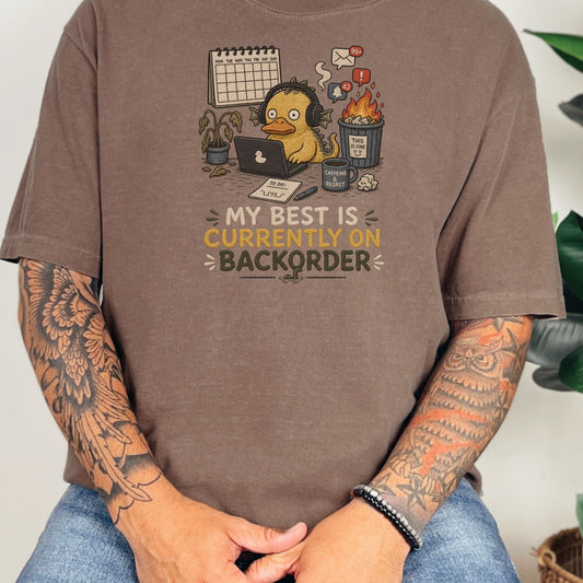 Cartoon duck with headphones at laptop, text reads "MY BEST IS CURRENTLY ON BACKORDER."