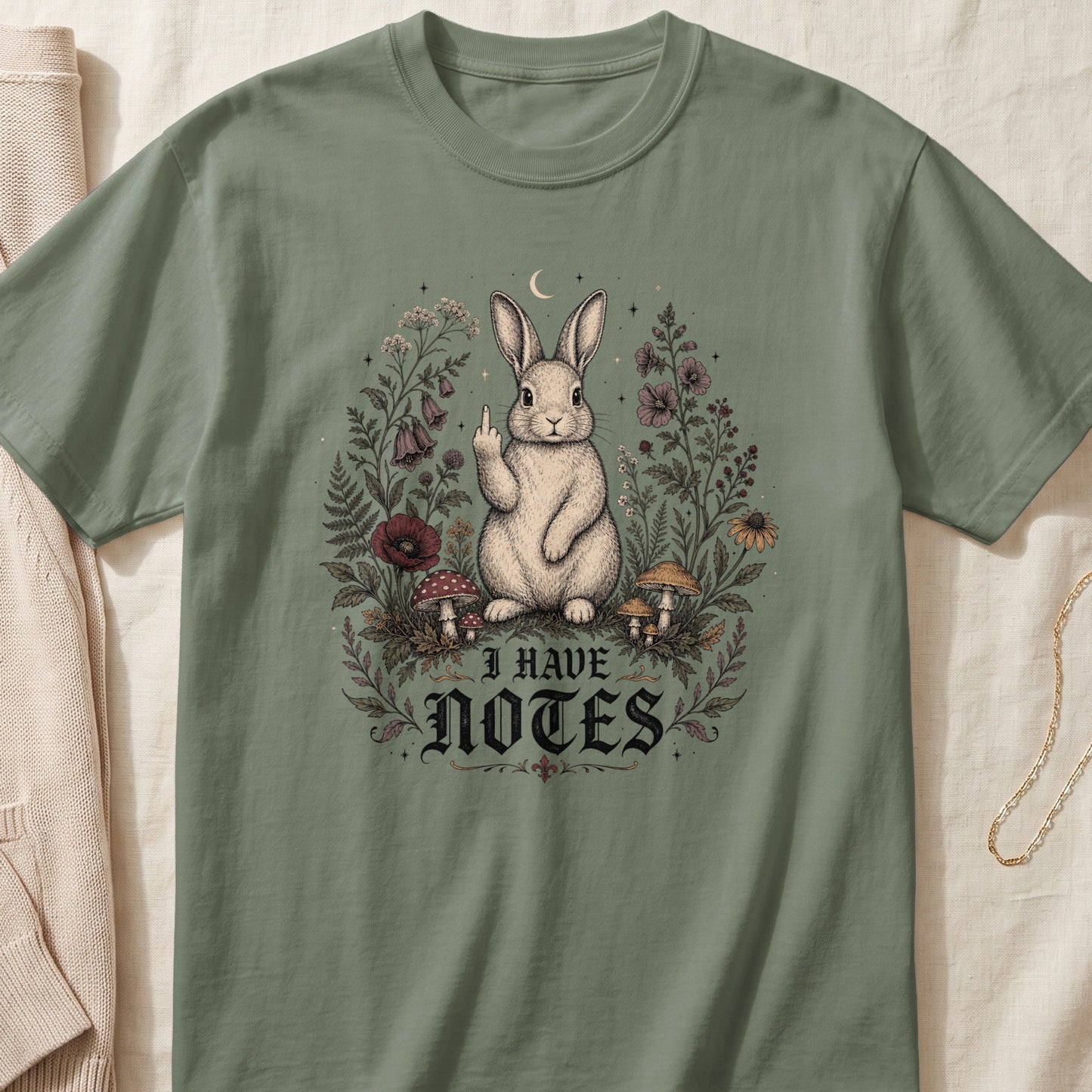 Sage green t-shirt with a rabbit illustration and "I HAVE NOTES" text.