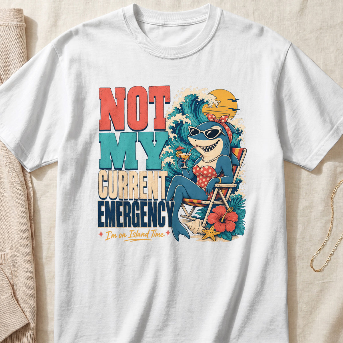 Shark in sunglasses relaxing on beach chair with text "Not My Current Emergency."