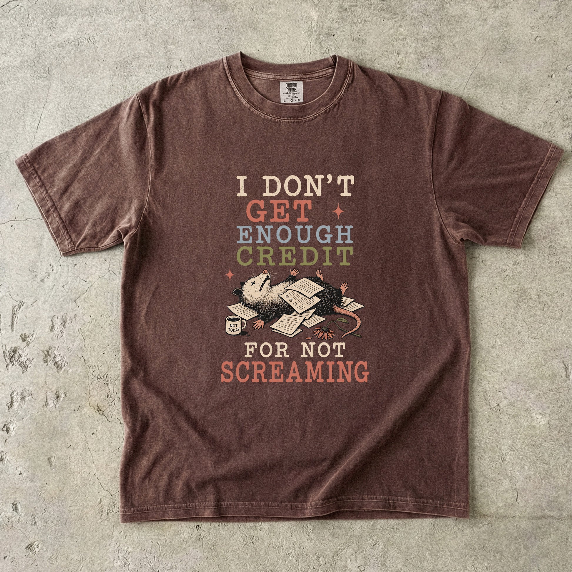 Brown t-shirt with graphic text "I DON'T GET ENOUGH CREDIT FOR NOT SCREAMING" and a possum.