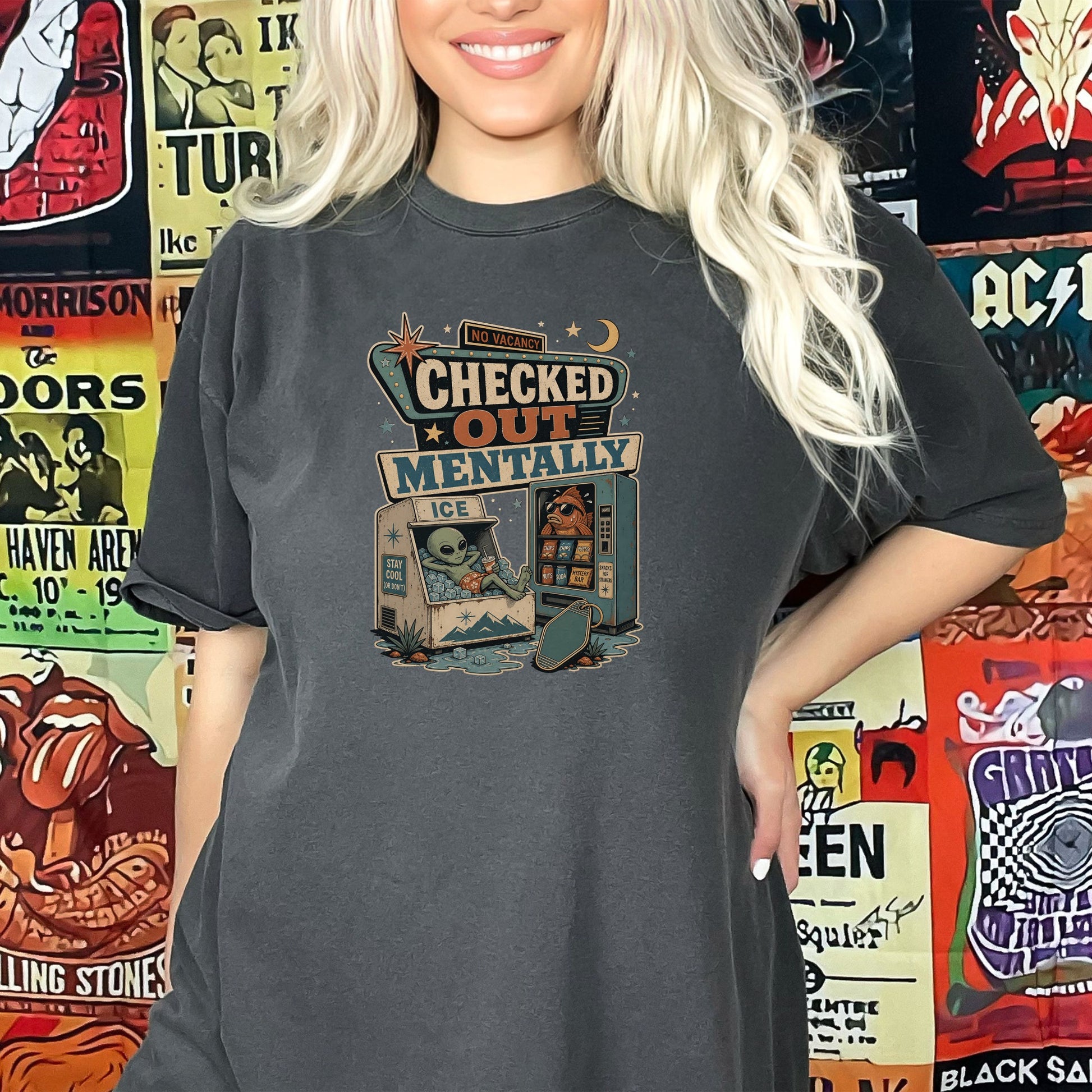 Graphic tee with "Checked Out Mentally" text, alien, and vending machine.