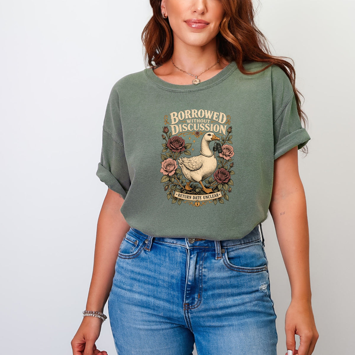 Green t-shirt with goose design, "Borrowed Without Discussion" text, and "Return Date Unclear" banner.