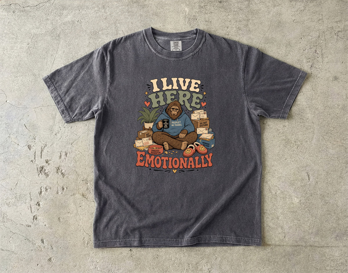 Bigfoot sits with coffee mug reading "My People? No Thanks." and "I Live Here Emotionally".