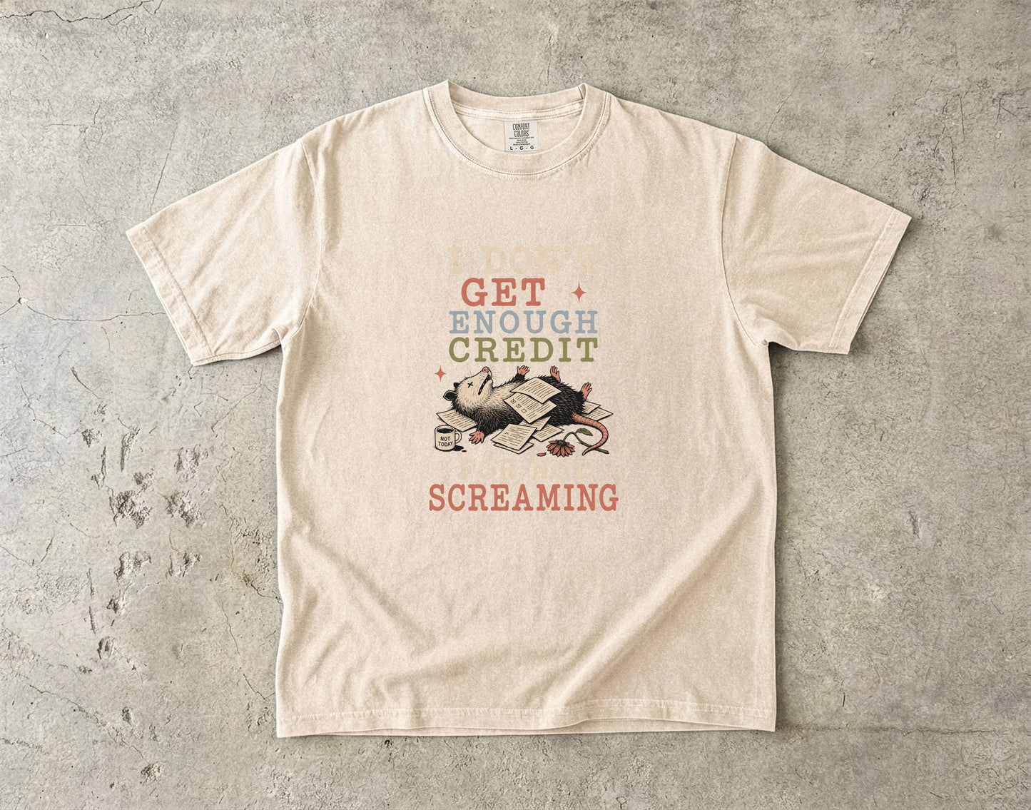 Opossum with papers and coffee mug, text reads "I DON'T GET ENOUGH CREDIT FOR NOT SCREAMING".