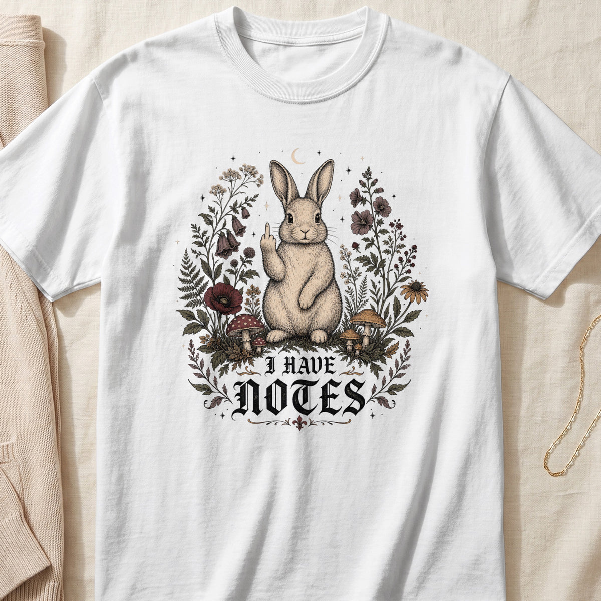 White t-shirt with a rabbit giving the middle finger and text that reads "I HAVE NOTES".