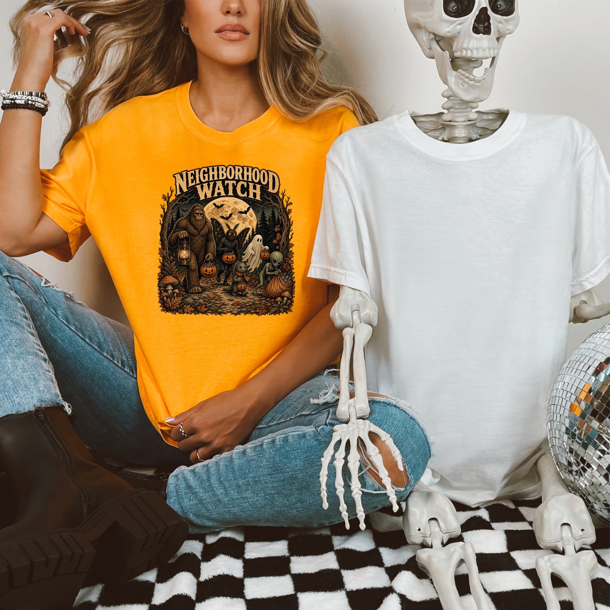 Orange t-shirt with "Neighborhood Watch" text and Halloween graphic with Bigfoot.