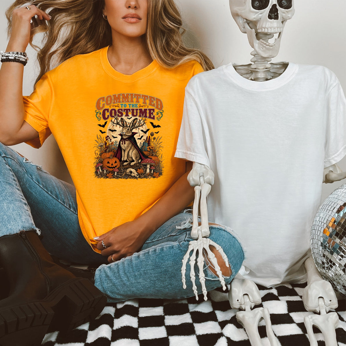 Orange t-shirt with "Committed to the Costume" text and Halloween-themed rabbit graphic.