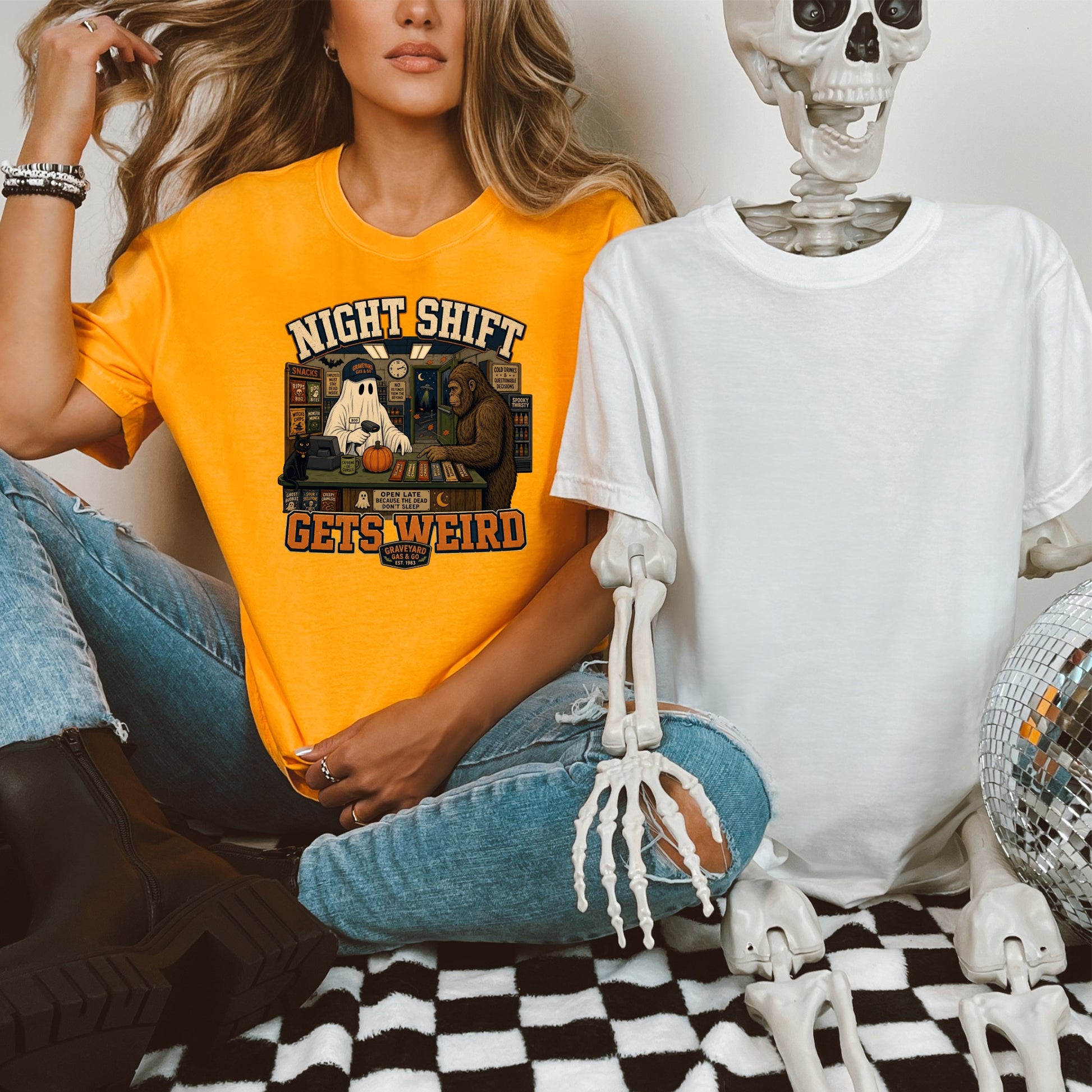 Orange t-shirt with "Night Shift Gets Weird" text and graphic of ghost, Sasquatch, and convenience store items.