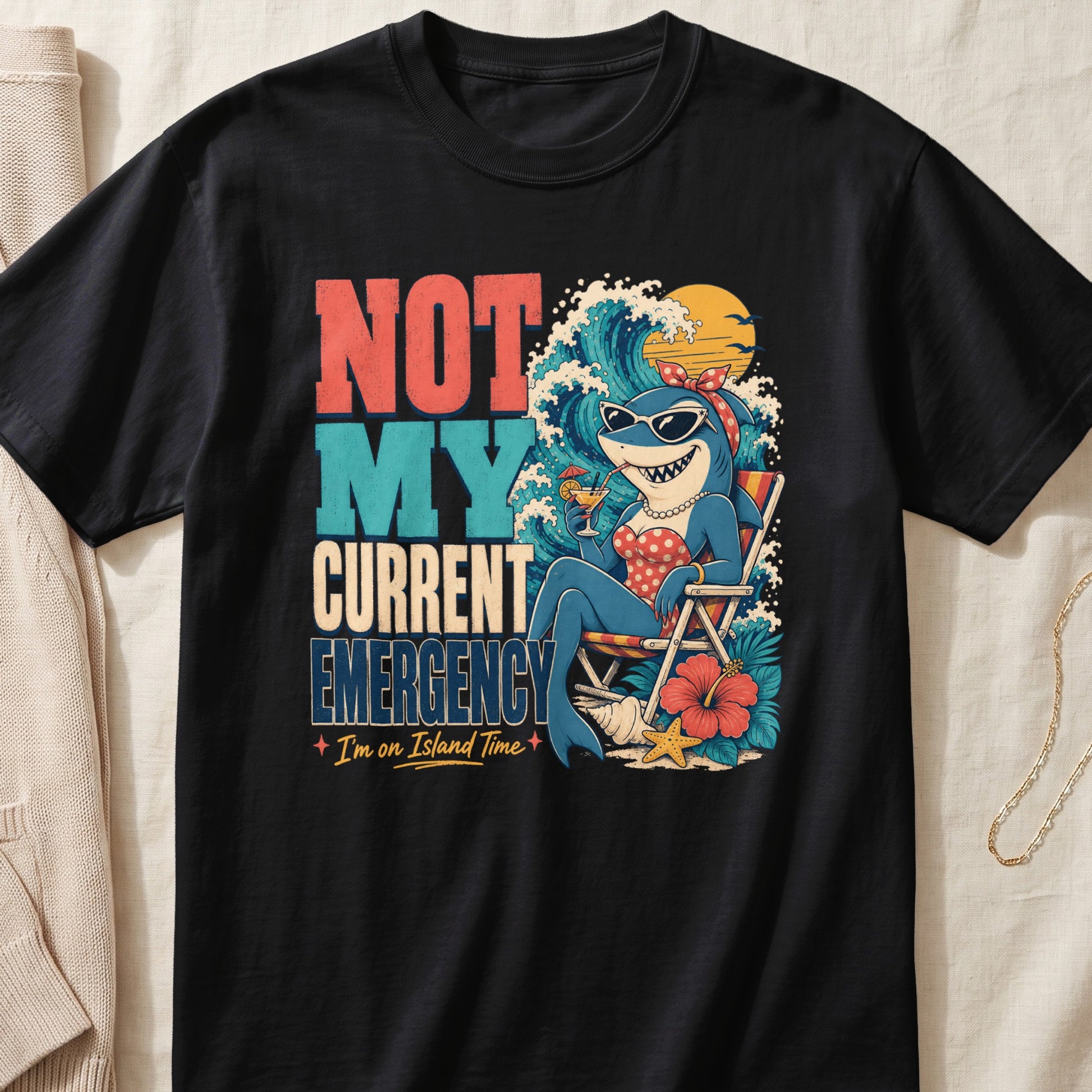Black t-shirt with "Not My Current Emergency. I'm on Island Time." text and a shark on vacation.