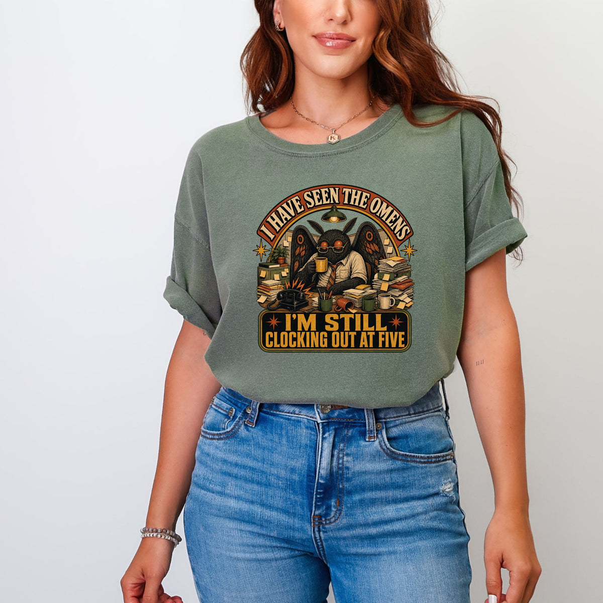 T-shirt with graphic depicting winged creature saying "I have seen the omens, I'm still clocking out at five."