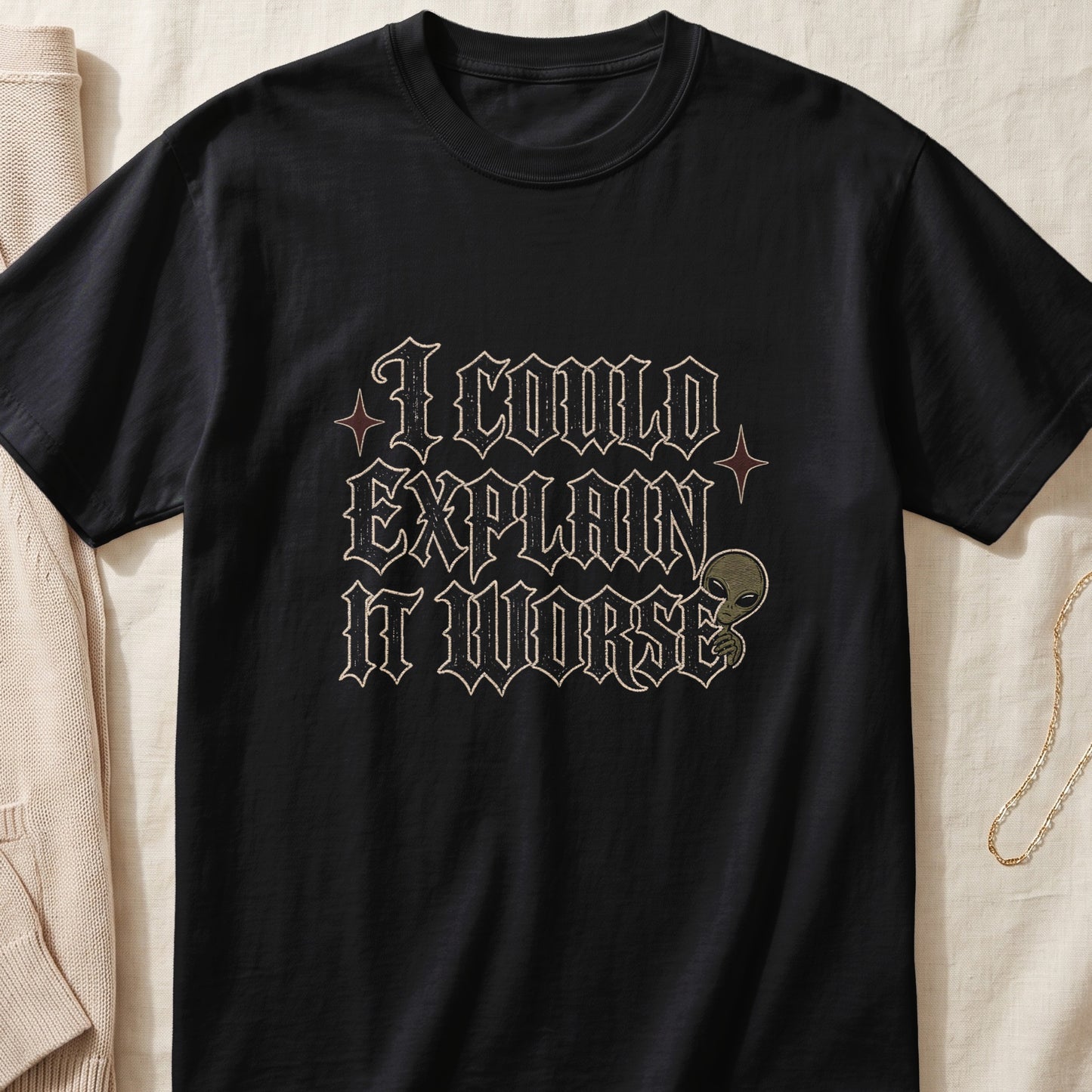 Black t-shirt with "I COULD EXPLAIN IT WORSE" text and an alien graphic.