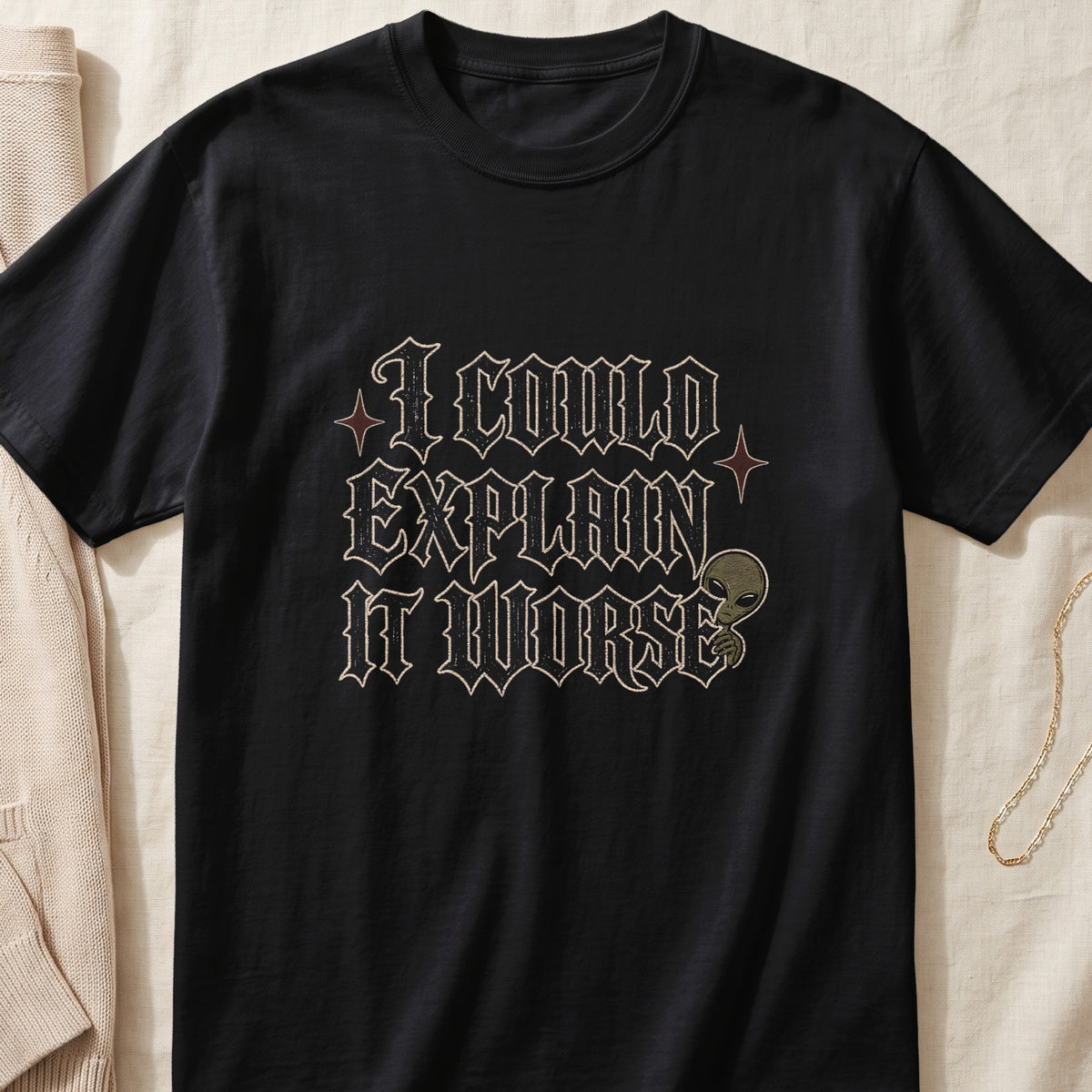 Black t-shirt with "I COULD EXPLAIN IT WORSE" text and an alien graphic.