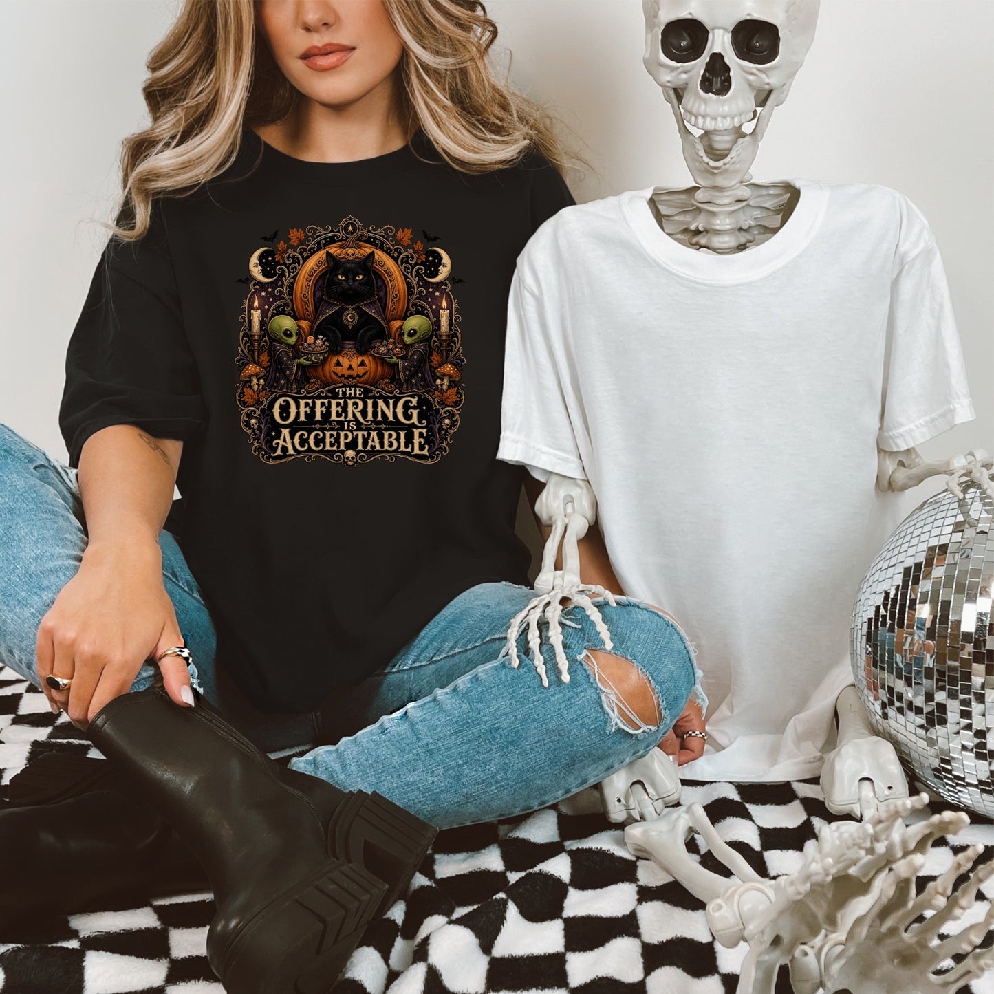 Black t-shirt with a Halloween graphic featuring a black cat and text, "The Offering is Acceptable."