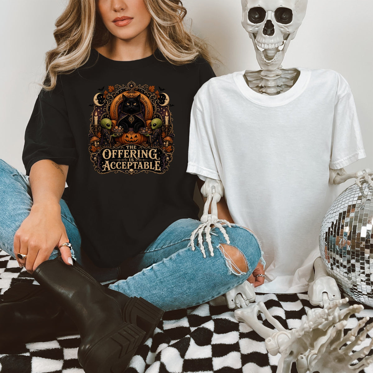 Black t-shirt with a Halloween graphic featuring a black cat and text, "The Offering is Acceptable."