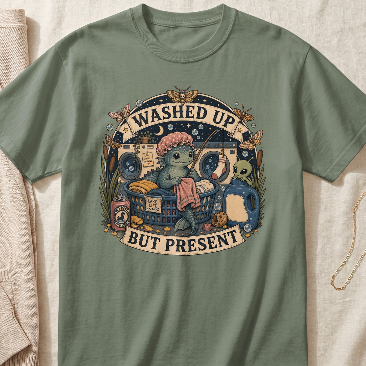 Mythical creature and alien in laundry scene with text "Washed Up But Present".