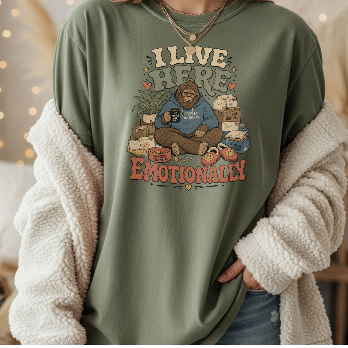 Bigfoot sitting with mug and slippers, text I live here emotionally.