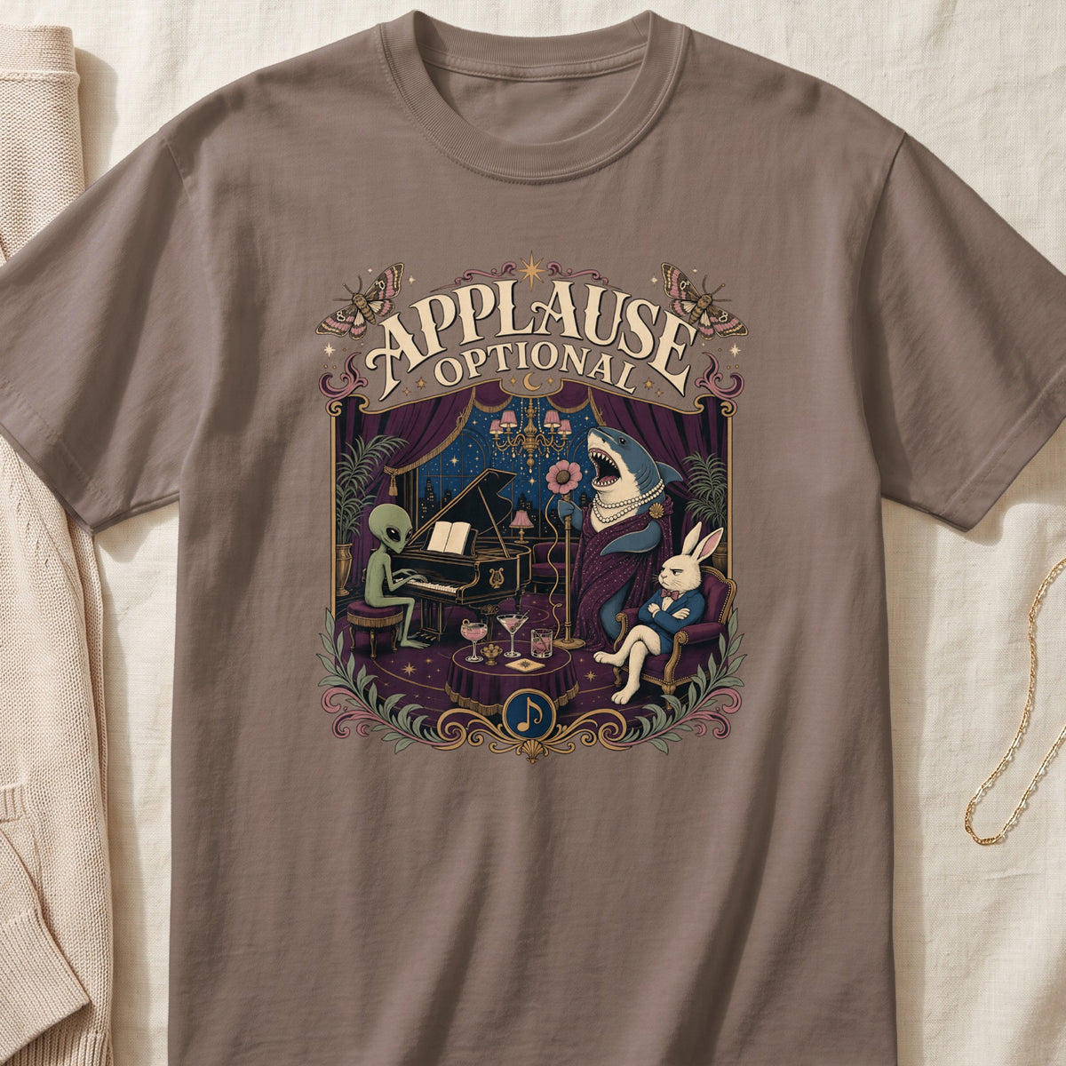 T-shirt graphic with an alien playing piano, shark singing, and rabbit audience.