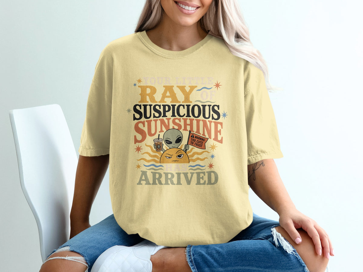 Yellow t-shirt graphic: Your little ray of suspicious sunshine has arrived.