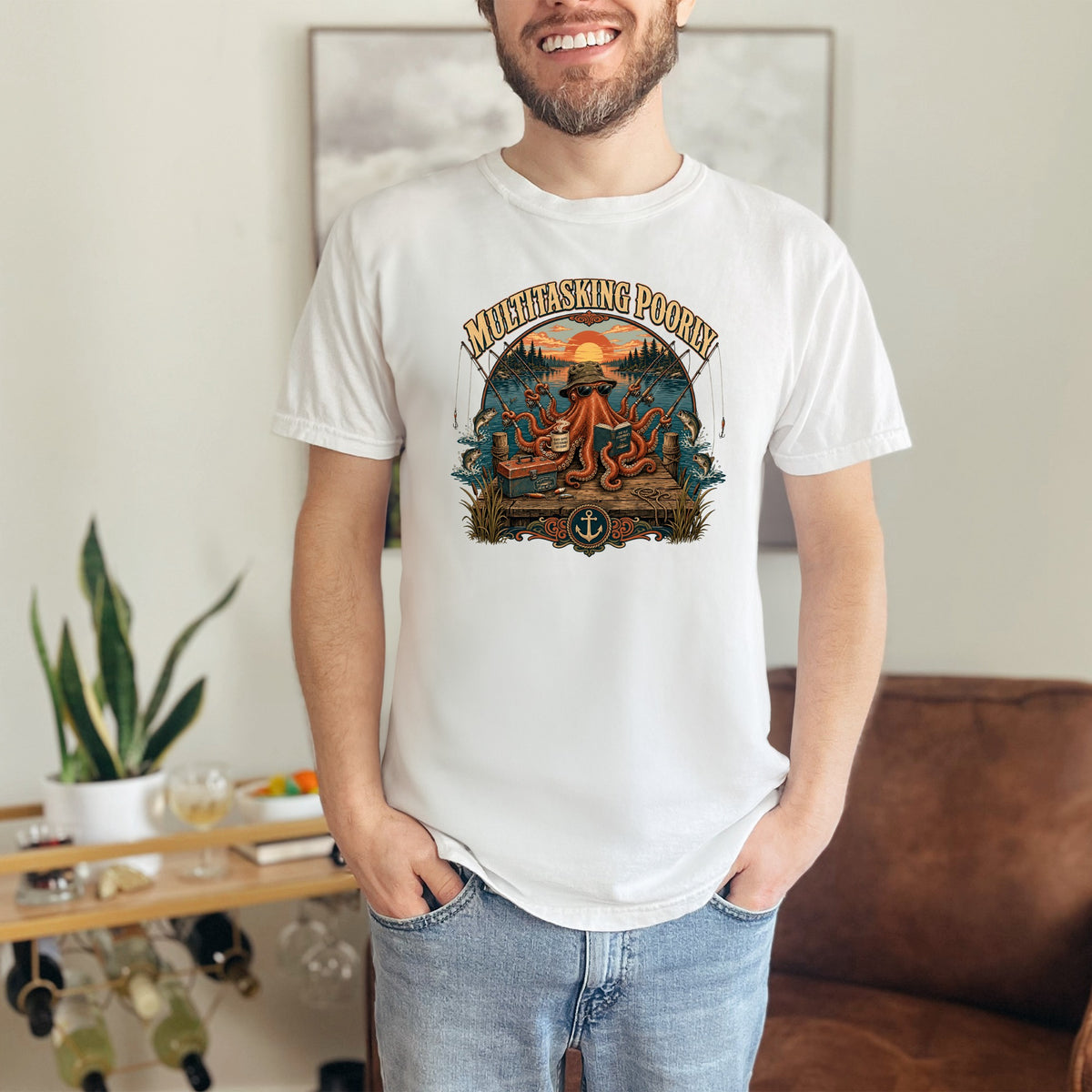 T-shirt graphic of an octopus fishing with text "MULTITASKING POORLY".