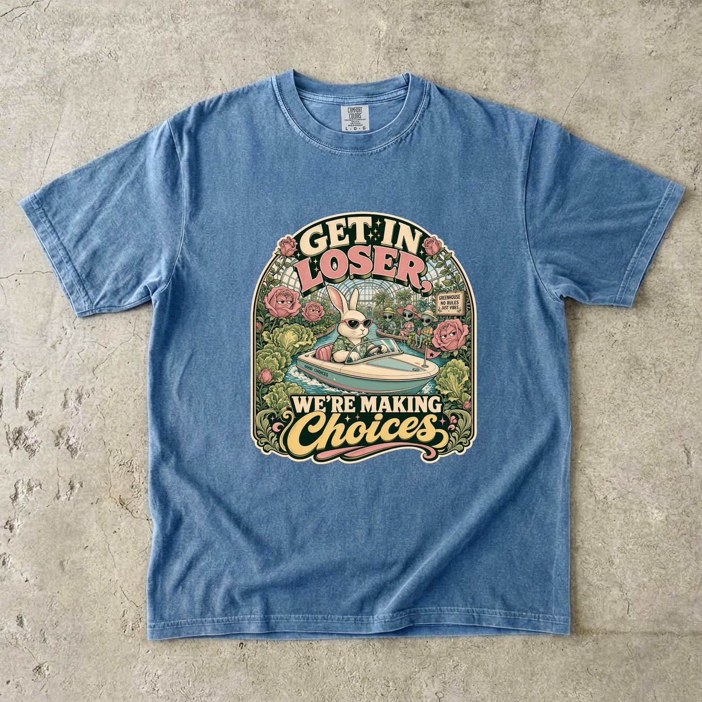 Blue t-shirt with "GET IN LOSER, WE'RE MAKING Choices" graphic featuring a bunny in a boat.