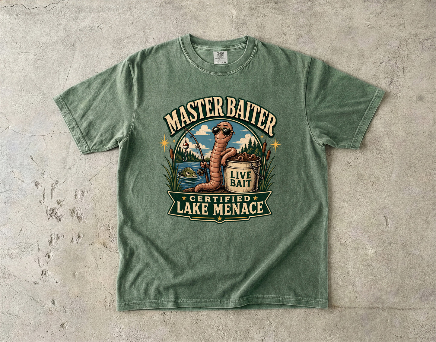 Green t-shirt graphic with worm, fishing rod, bucket of bait, and text "Master Baiter Certified Lake Menace".