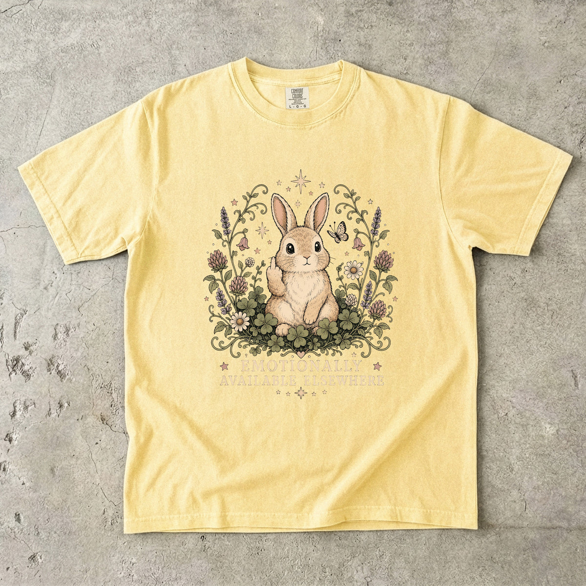 Yellow t-shirt with a rabbit giving the middle finger and the text "Emotionally Available Elsewhere".