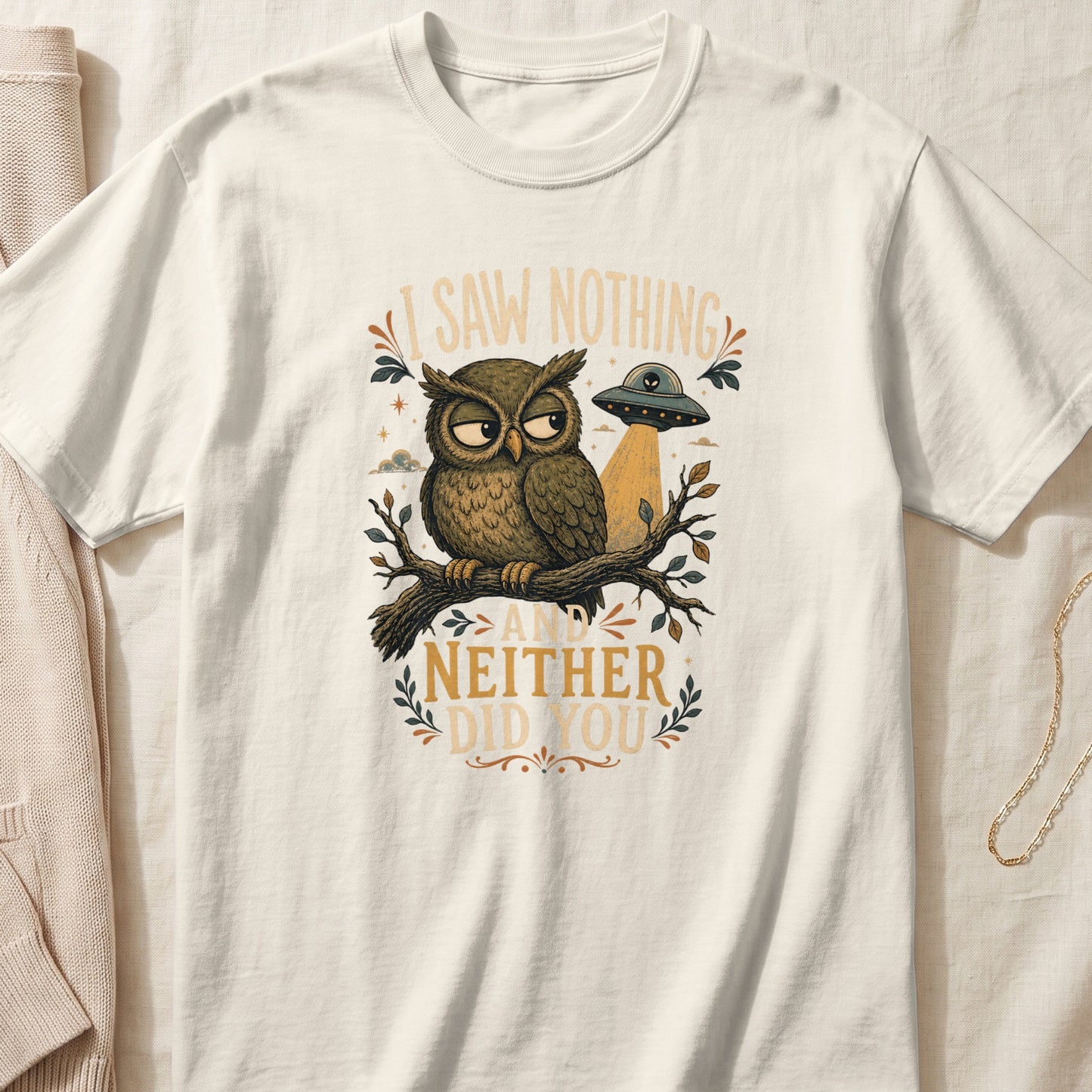 An owl sits on a branch with a UFO above it and text reading "I Saw Nothing And Neither Did You".