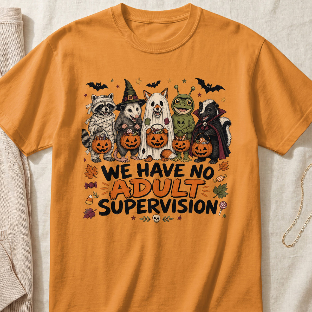 Orange t-shirt with Halloween animals and text "WE HAVE NO ADULT SUPERVISION".