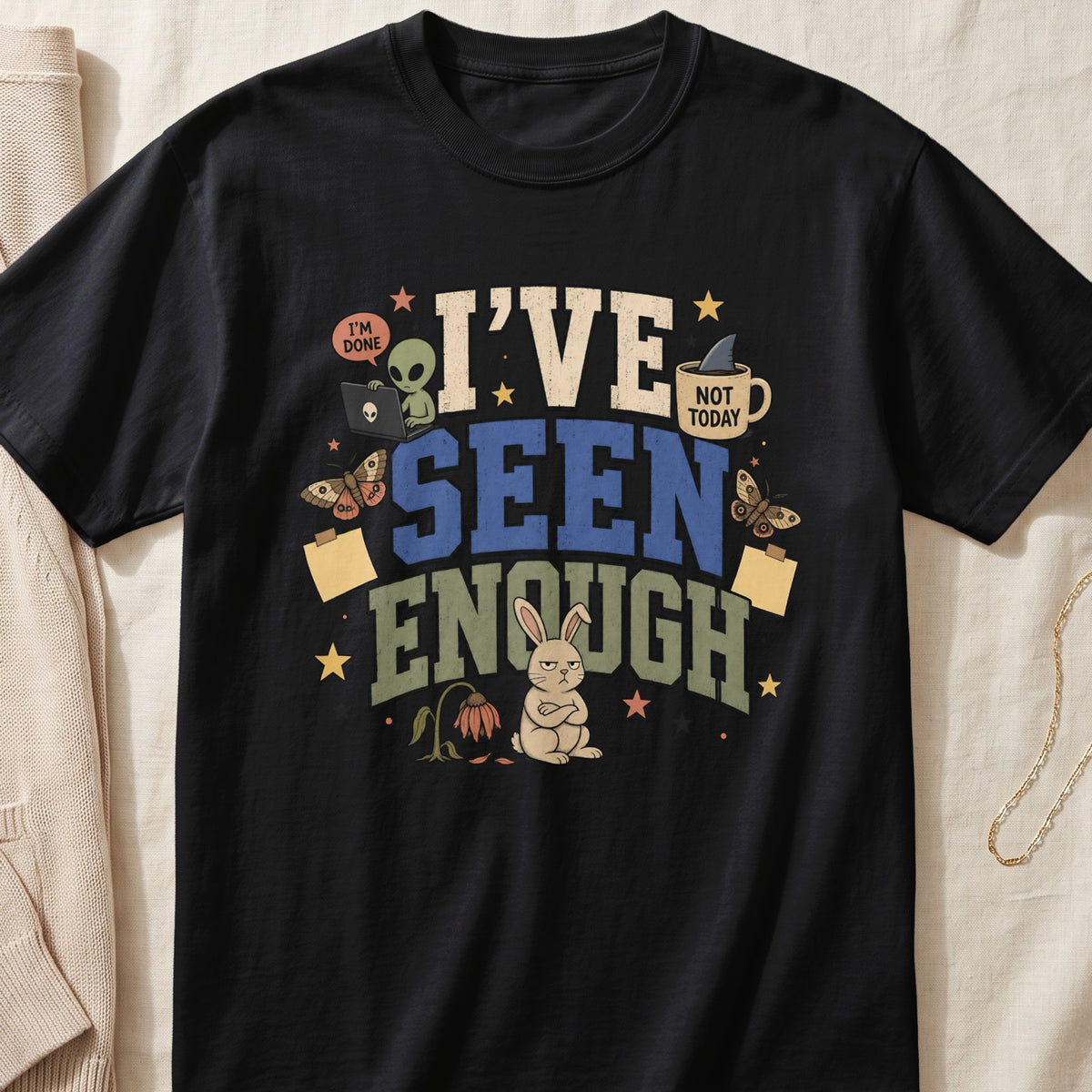 Black t-shirt with "I'VE SEEN ENOUGH" text, alien, bunny, and butterflies.