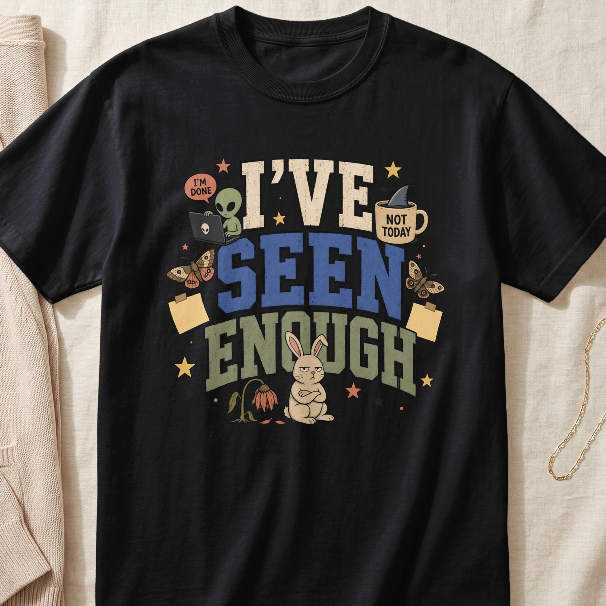 Black t-shirt with "I'VE SEEN ENOUGH" text, alien, bunny, and butterflies.