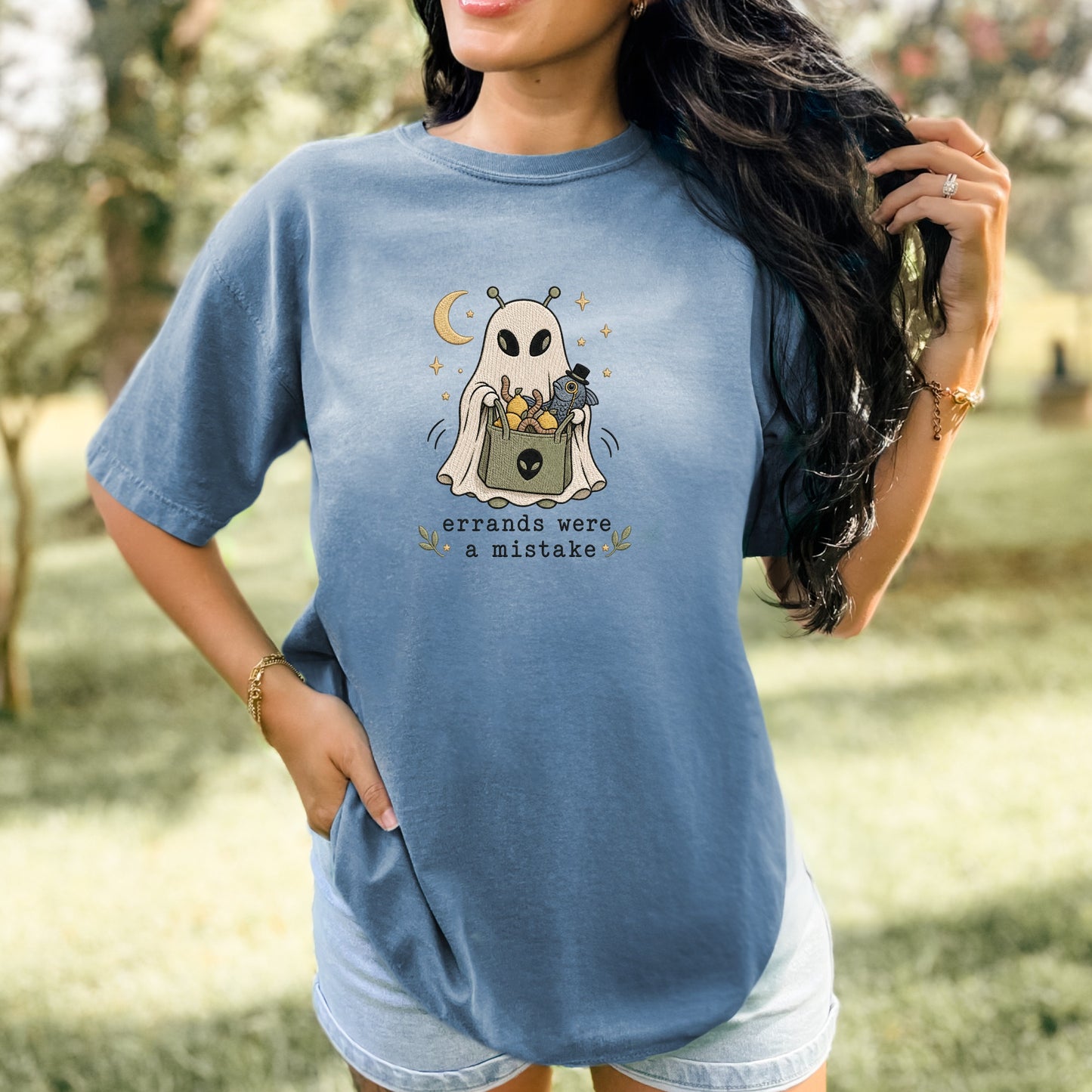 Blue t-shirt with a ghost graphic and the text "errands were a mistake".