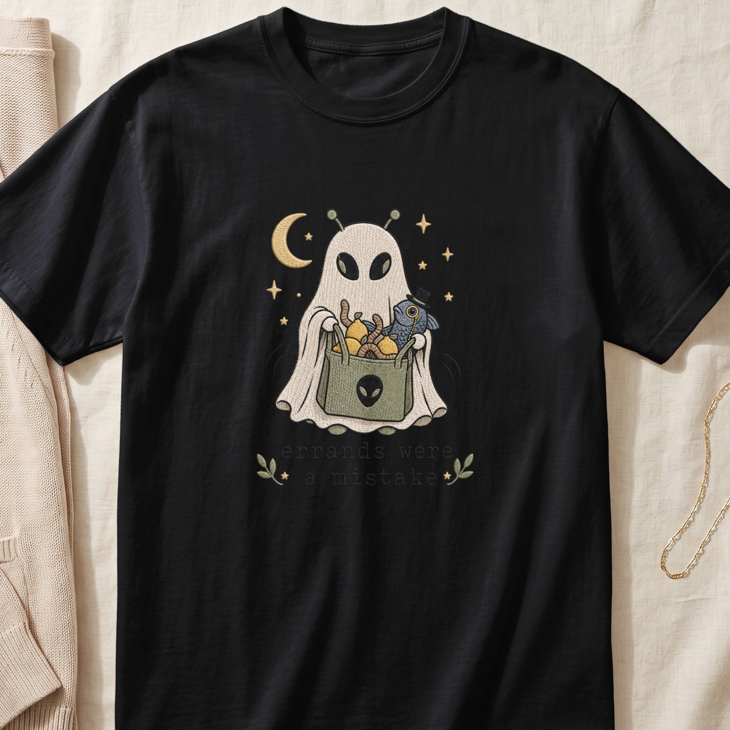 Black t-shirt with embroidered ghost holding a bag and text "errands were a mistake."