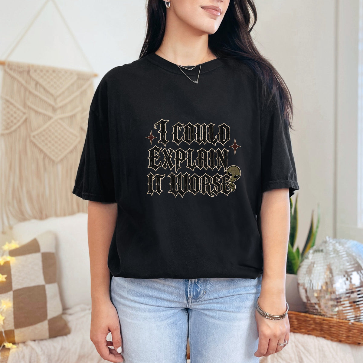 Black t-shirt with text "I COULD EXPLAIN IT WORSE" and an alien graphic.